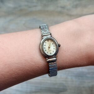 Vintage Dainty Silver Tone Watch Stretch Band Oval Face Minimal Classic 90s